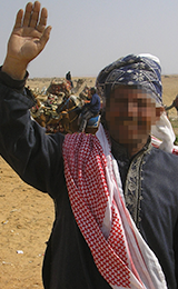 Muslim man in Middle East smiles and waves